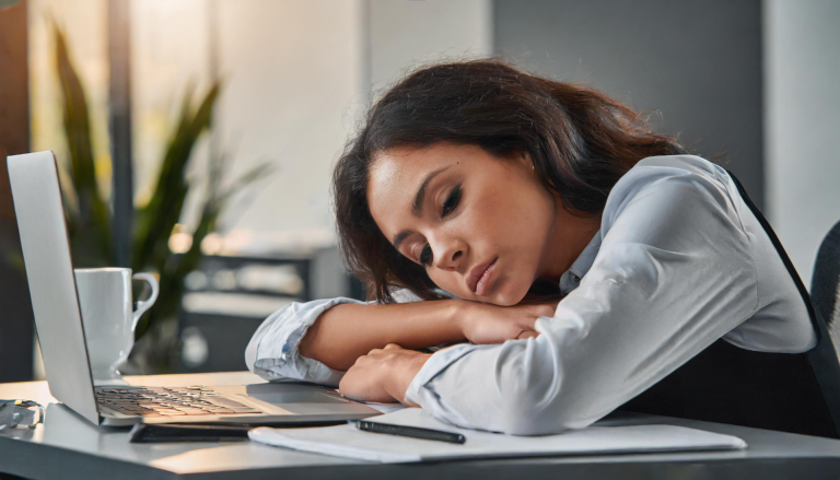 tired woman on her laptop