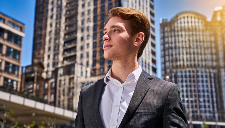 motivated men in suit in the city sorrounded by buildings for How to revamp your life