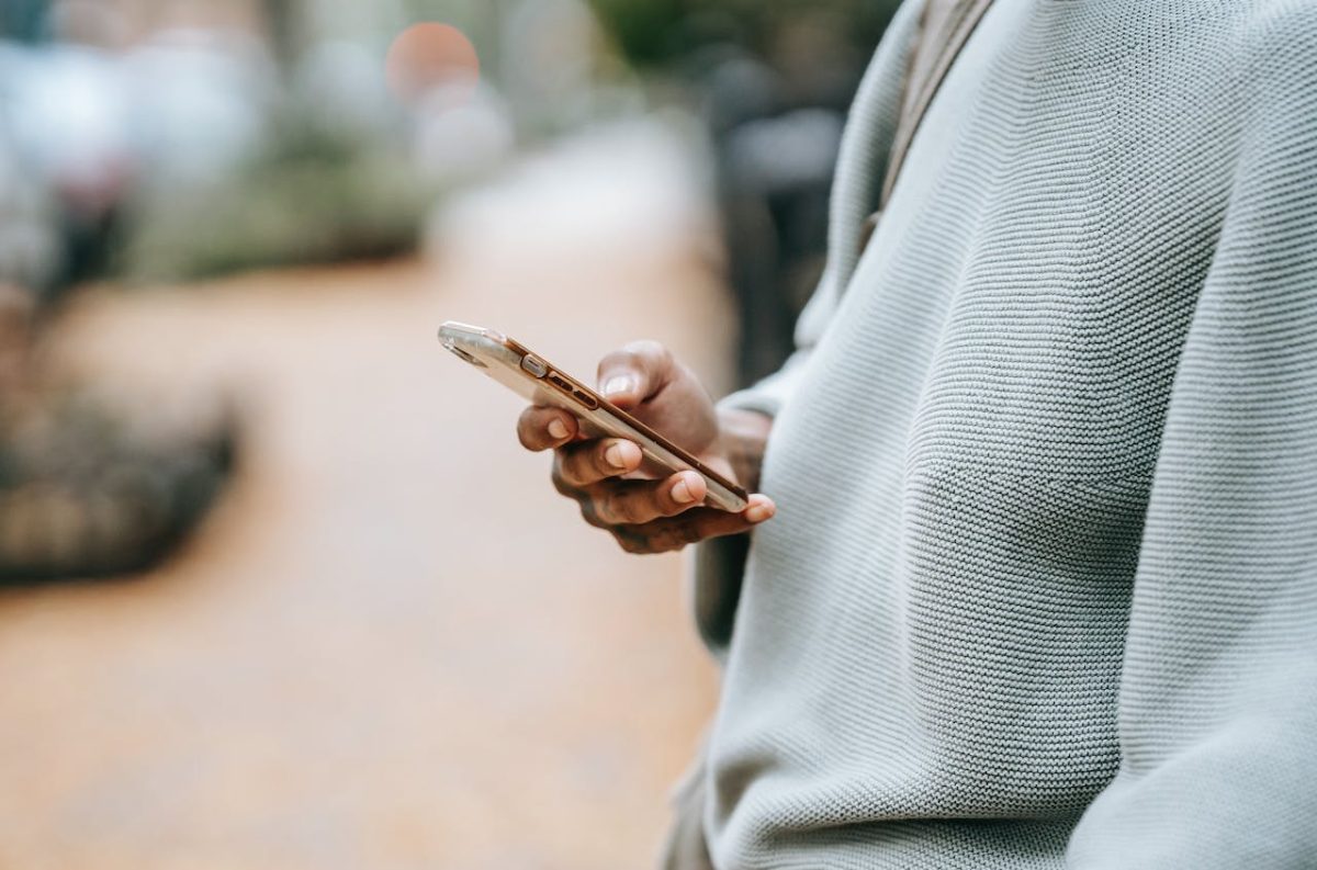 AI Coaching Platform Humans In Loop Holding Mobile Phone