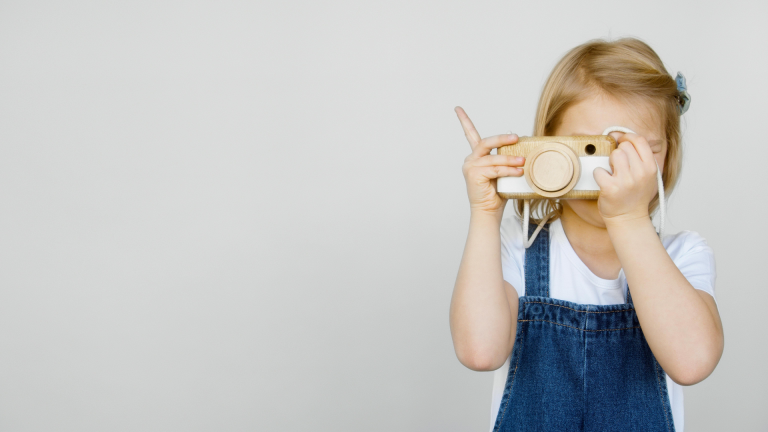 Building Self Discipline in Children: a little girl taking a photo