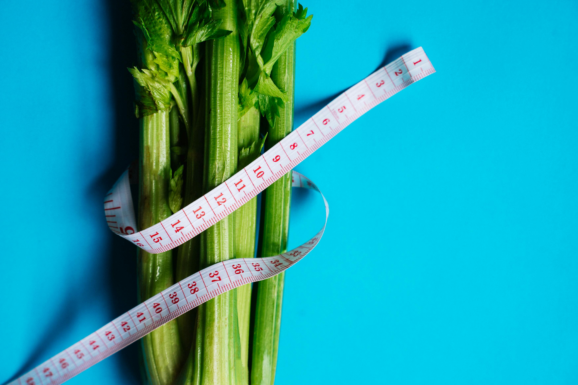 Start Your Weight Loss Journey: celery vegetable wrapped with tape measure